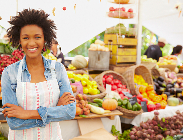 Woman standing in front of a farmer's market