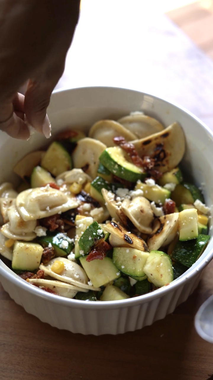 Pierogy Pasta Salad w/ Shaved Corn, Feta Cheese, Sun-Dried Tomatoes, & Seasonal Vinaigrette