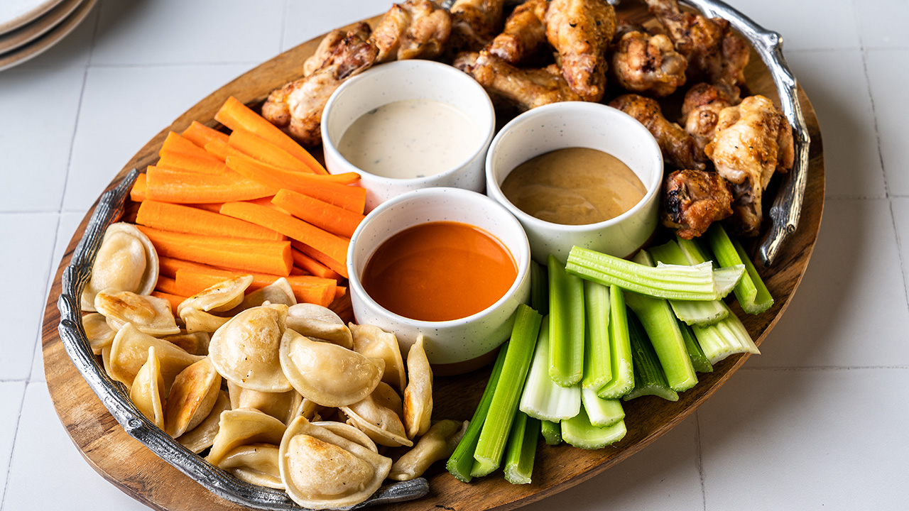 Grilled Pierogies and Chicken Wings with Honey Mustard, Buffalo Sauce and Ranch