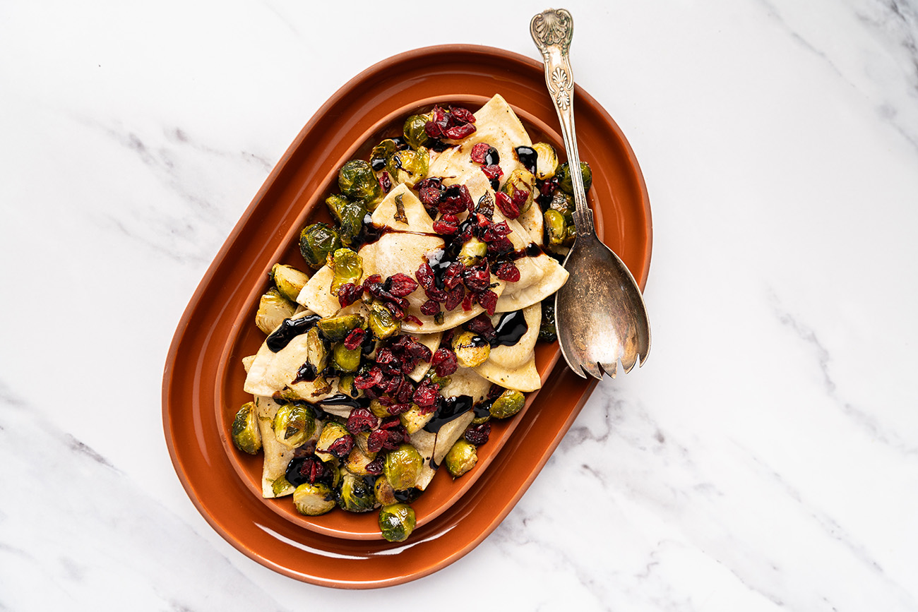 Roasted Brussels Sprouts and Pierogies with Craisins and Balsamic Glaze